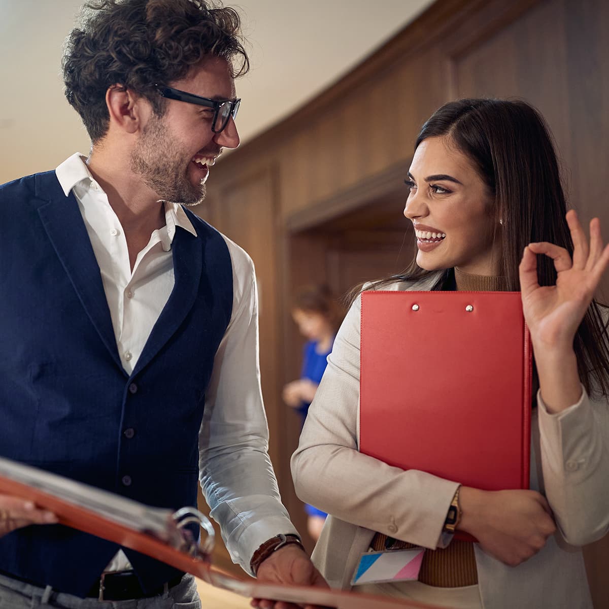 Two colleague hotel coworkers consulting together