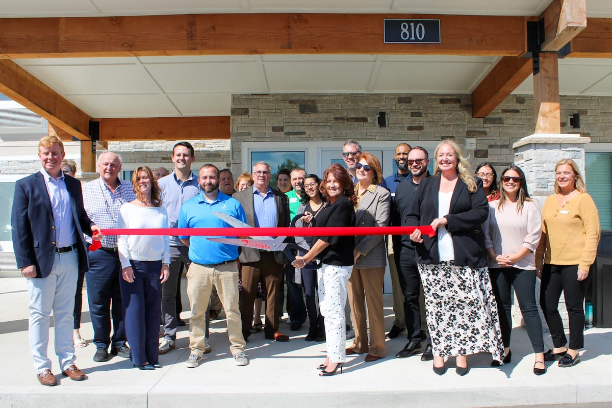 Holladay Hospitality's team joins local leaders for a ribbon cutting ceremony at WoodSpring Suites Elkhart.